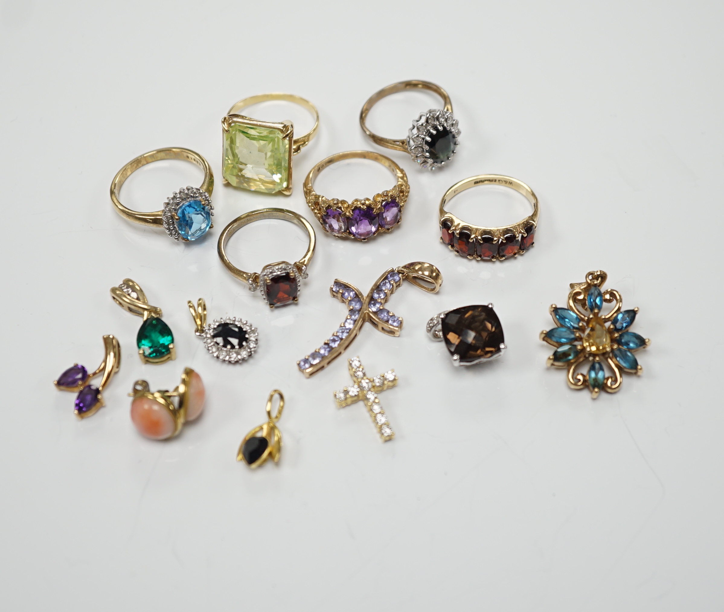 Five assorted modern 9ct gold and gem set rings, including garnet and amethyst, one other yellow metal and gem set ring, six assorted modern 9ct gold and gem set pendants, two other pendants including diamond set cross a